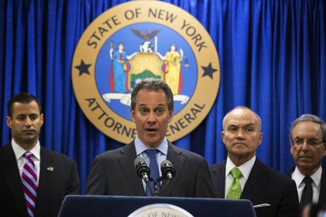 New York Attorney General Eric Schneiderman (C) speaks at a news conference announcing an organized crime task force take down of an unstamp New York Attorney General Eric Schneiderman (C) speaks at a news conference announcing an organized crime task force take down of an unstamp