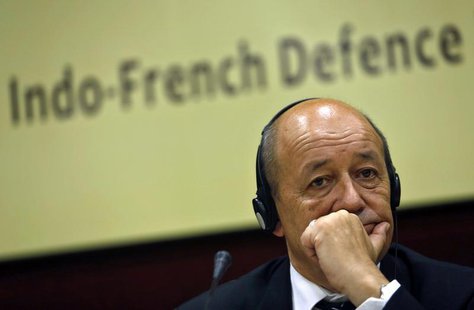 French Defence Minister Jean-Yves Le Drian listens to a reporter's question before addressing a gathering at the Institute for Defence Studi French Defence Minister Jean-Yves Le Drian listens to a reporter's question before addressing a gathering at the Institute for Defence Studi