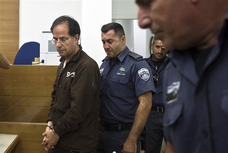 Iranian-Belgian citizen Ali Mansouri arrives at a courtroom at the magistrate's court in Petah Tikva near Tel Aviv September 30, 2013. REUTE Iranian-Belgian citizen Ali Mansouri arrives at a courtroom at the magistrate's court in Petah Tikva near Tel Aviv September 30, 2013. REUTE
