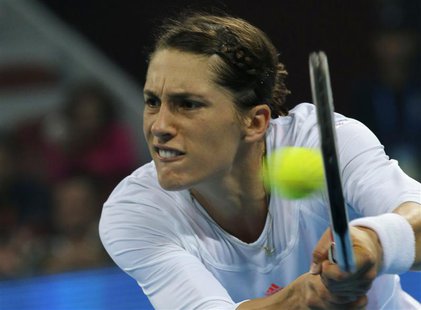 Andrea Petkovic of Germany hits a return against Victoria Azarenka of Belarus at the China Open tennis tournament in Beijing September 30, 2 Andrea Petkovic of Germany hits a return against Victoria Azarenka of Belarus at the China Open tennis tournament in Beijing September 30, 2