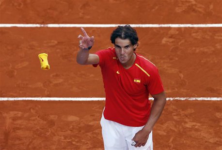 Spain's Rafael Nadal throws his wristband to the public after winning against Ukraine at the end of their Davis Cup World Group playoff tenn Spain's Rafael Nadal throws his wristband to the public after winning against Ukraine at the end of their Davis Cup World Group playoff tenn