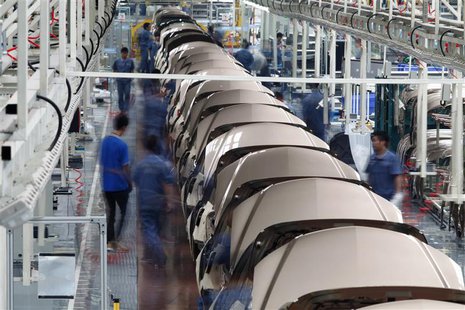 Employees work along a Geely Automobile Corporation assembly line in Cixi, Zhejiang province in this June 21, 2012 file photo. REUTERS/Carlo Employees work along a Geely Automobile Corporation assembly line in Cixi, Zhejiang province in this June 21, 2012 file photo. REUTERS/Carlo