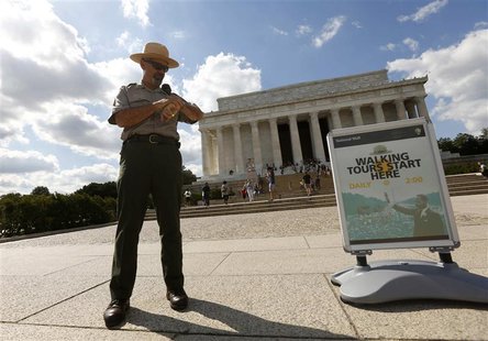U.S. National Park Ranger Mark Ragan checks his watch while on duty in front of the Lincoln Memorial in Washington September 30, 2013. REUTE U.S. National Park Ranger Mark Ragan checks his watch while on duty in front of the Lincoln Memorial in Washington September 30, 2013. REUTE