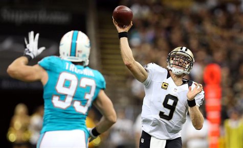 New Orleans Saints quarterback Drew Brees (9) makes a throw over New Orleans Saints outside linebacker Junior Galette (93) during the second New Orleans Saints quarterback Drew Brees (9) makes a throw over New Orleans Saints outside linebacker Junior Galette (93) during the second