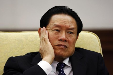 Then China's Public Security Minister Zhou Yongkang reacts as he attends the Hebei delegation discussion sessions at the 17th National Congr Then China's Public Security Minister Zhou Yongkang reacts as he attends the Hebei delegation discussion sessions at the 17th National Congr