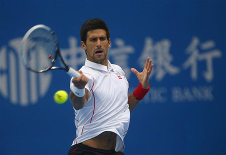 Serbia's Novak Djokovic returns a shot during his match against Lukas Rosol of the Czech Republic at the China Open tennis tournament in Bei Serbia's Novak Djokovic returns a shot during his match against Lukas Rosol of the Czech Republic at the China Open tennis tournament in Bei