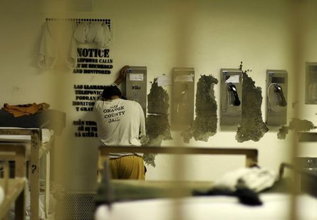 An inmate makes a phone call from his cell at the Orange County jail in Santa Ana, California, May 24, 2011. REUTERS/Lucy Nicholson An inmate makes a phone call from his cell at the Orange County jail in Santa Ana, California, May 24, 2011. REUTERS/Lucy Nicholson