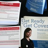 Information cards are stacked on a table during an Affordable Care Act outreach event for the Latino community in Los Angeles, California Se Information cards are stacked on a table during an Affordable Care Act outreach event for the Latino community in Los Angeles, California Se