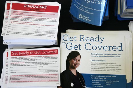 Information cards are stacked on a table during an Affordable Care Act outreach event for the Latino community in Los Angeles, California Se Information cards are stacked on a table during an Affordable Care Act outreach event for the Latino community in Los Angeles, California Se