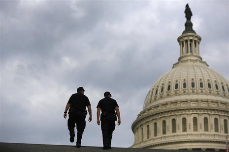U.S. Capitol Police return to patrol after a brief meeting to discuss how to handle tourists turned away from the shuttered visitor's center U.S. Capitol Police return to patrol after a brief meeting to discuss how to handle tourists turned away from the shuttered visitor's center