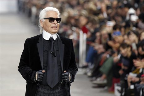 German designer Karl Lagerfeld appears at the end of his Spring/Summer 2014 women's ready-to-wear fashion show for French fashion house Chan German designer Karl Lagerfeld appears at the end of his Spring/Summer 2014 women's ready-to-wear fashion show for French fashion house Chan