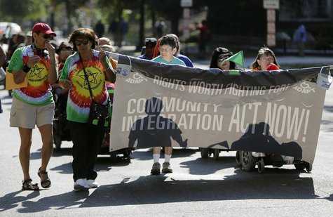 Members of ADAPT, a grassroots disability rights group that supports Obamacare, march in Washington during the U.S. government shutdown Octo Members of ADAPT, a grassroots disability rights group that supports Obamacare, march in Washington during the U.S. government shutdown Octo