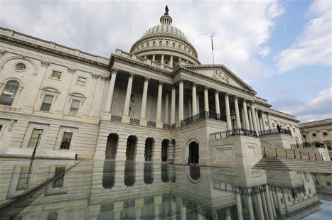 The U.S. Capitol dome is reflected in water on Capitol Hill in Washington after the U.S. government shutdown, October 1, 2013. REUTERS/Larry The U.S. Capitol dome is reflected in water on Capitol Hill in Washington after the U.S. government shutdown, October 1, 2013. REUTERS/Larry
