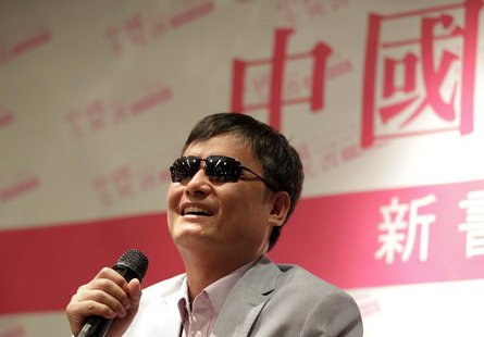 Chinese dissident Chen Guangcheng attends the book release event for "China, the Book of Living and Dying" in Taipei June 27, 2013. REUTERS/ Chinese dissident Chen Guangcheng attends the book release event for "China, the Book of Living and Dying" in Taipei June 27, 2013. REUTERS/