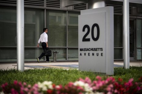 A worker arrives at the Department of Homeland Security on Tuesday morning after the federal government was shutdown when the House and Sena A worker arrives at the Department of Homeland Security on Tuesday morning after the federal government was shutdown when the House and Sena