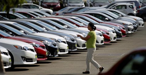 A woman walks by vehicles for sale at a Toyota dealership in Pasadena, California October 10, 2012. REUTERS/Mario Anzuoni A woman walks by vehicles for sale at a Toyota dealership in Pasadena, California October 10, 2012. REUTERS/Mario Anzuoni