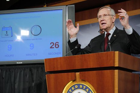 U.S. Senate Majority Leader Harry Reid (D-NV) stands next to a countdown clock as he speaks at a news conference at the U.S. Capitol in Wash U.S. Senate Majority Leader Harry Reid (D-NV) stands next to a countdown clock as he speaks at a news conference at the U.S. Capitol in Wash