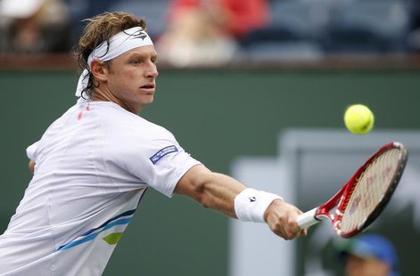 David Nalbandian of Argentina returns a shot against Marcel Granollers of Spain during their match at the BNP Paribas Open ATP tennis tourna David Nalbandian of Argentina returns a shot against Marcel Granollers of Spain during their match at the BNP Paribas Open ATP tennis tourna