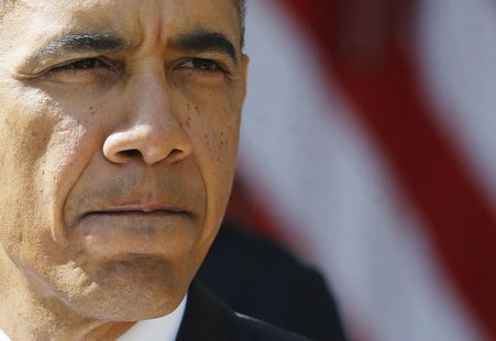 U.S. President Barack Obama delivers remarks alongside Americans (unseen) the White House says will benefit from the opening of health insur U.S. President Barack Obama delivers remarks alongside Americans (unseen) the White House says will benefit from the opening of health insur