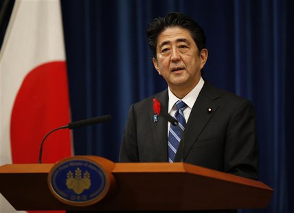 Japan's Prime Minister Shinzo Abe attends a news conference to announce a raise in the sales tax rate at his official residence in Tokyo Oct Japan's Prime Minister Shinzo Abe attends a news conference to announce a raise in the sales tax rate at his official residence in Tokyo Oct
