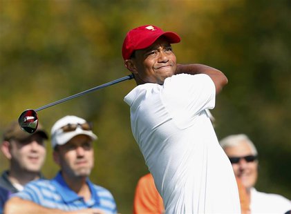 U.S. team member Tiger Woods hits off the third tee during the first practice round for the 2013 Presidents Cup golf tournament at Muirfield U.S. team member Tiger Woods hits off the third tee during the first practice round for the 2013 Presidents Cup golf tournament at Muirfield
