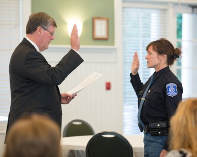 Grand Valley State Public Safety Director Renee Freeman (R) is sworn into office by school president Thomas Haas during ceremonies at the Alumni House in Allendale, MI on Sept. 30, 2013. (photo courtesy Grand Valley State University) Grand Valley State Public Safety Director Renee Freeman (R) is sworn into office by school president Thomas Haas during ceremonies at the Alumni House in Allendale, MI on Sept. 30, 2013. (photo courtesy Grand Valley State University)