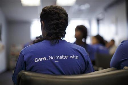 Get Covered America volunteers listen to a training session before canvassing a Chicago, Illinois neighborhood to talk with residents about the Affordable Care Act - also known as Obamacare - September 7, 2013.
Credit: Reuters/John Gress
Get Covered America volunteers listen to a training session before canvassing a Chicago, Illinois neighborhood to talk with residents about the Affordable Care Act - also known as Obamacare - September 7, 2013.
Credit: Reuters/John Gress