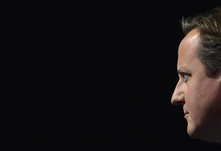 Britain's Prime Minister David Cameron listens as London Mayor Boris Johnson delivers his keynote speech to the Conservative Party annual co Britain's Prime Minister David Cameron listens as London Mayor Boris Johnson delivers his keynote speech to the Conservative Party annual co