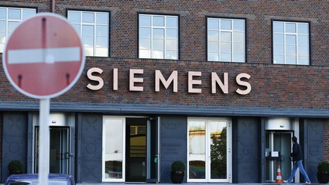 A man enters the office building of Siemens AG in Berlin September 30, 2013. REUTERS/Tobias Schwarz A man enters the office building of Siemens AG in Berlin September 30, 2013. REUTERS/Tobias Schwarz