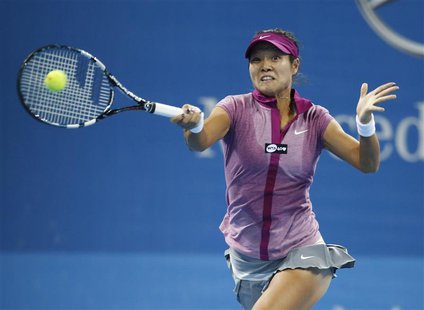 Li Na of China returns a shot against Sabine Lisicki of Germany during their match at the China Open tennis tournament in Beijing October 2, Li Na of China returns a shot against Sabine Lisicki of Germany during their match at the China Open tennis tournament in Beijing October 2,