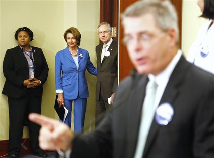 U.S. House Minority Leader Nancy Pelosi (2nd L) and Senate Democratic Majority Leader Harry Reid (3rd L) arrive at a rally to celebrate the U.S. House Minority Leader Nancy Pelosi (2nd L) and Senate Democratic Majority Leader Harry Reid (3rd L) arrive at a rally to celebrate the