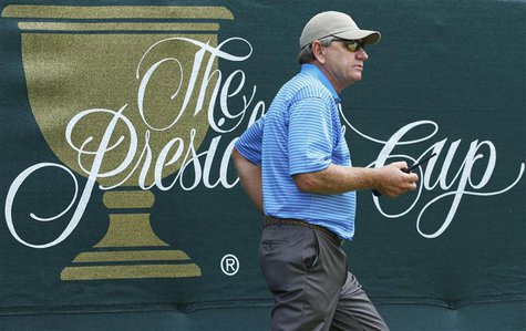 International Team captain Nick Price of Zimbabwe carries a two-way radio during the second practice round for the 2013 Presidents Cup golf International Team captain Nick Price of Zimbabwe carries a two-way radio during the second practice round for the 2013 Presidents Cup golf