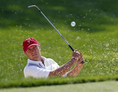 U.S. team member Jordan Spieth hits from a sand trap on the 10th hole during the first practice round for the 2013 Presidents Cup golf tourn U.S. team member Jordan Spieth hits from a sand trap on the 10th hole during the first practice round for the 2013 Presidents Cup golf tourn