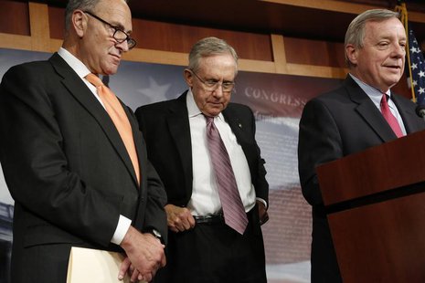 U.S. Senate Majority Leader Harry Reid (D-NV) (C) hitches up his belt during a news conference with Senator Charles Schumer (D-NY) (L) and S U.S. Senate Majority Leader Harry Reid (D-NV) (C) hitches up his belt during a news conference with Senator Charles Schumer (D-NY) (L) and S