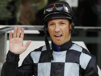 Jockey Frankie Dettori waves as he walks to the Parade Ring before the Princess Elizabeth Stakes race on Ladies Day during the Epsom Derby f Jockey Frankie Dettori waves as he walks to the Parade Ring before the Princess Elizabeth Stakes race on Ladies Day during the Epsom Derby f