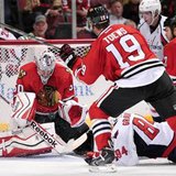 Chicago Blackhawks goaltender Corey Crawford stops a shot in front of Washington's Mikhail Grabovski (84) and Chicago's Jonathan Toews (19) during the Blackhawks' 6-4 win over the Capitals at Chicago's United Center on Oct. 1, 2013. (Reuters) Chicago Blackhawks goaltender Corey Crawford stops a shot in front of Washington's Mikhail Grabovski (84) and Chicago's Jonathan Toews (19) during the Blackhawks' 6-4 win over the Capitals at Chicago's United Center on Oct. 1, 2013. (Reuters)