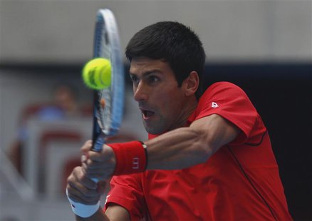 Novak Djokovic of Serbia returns a shot during his match against Fernando Verdasco of Spain at the China Open tennis tournament in Beijing O Novak Djokovic of Serbia returns a shot during his match against Fernando Verdasco of Spain at the China Open tennis tournament in Beijing O