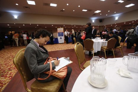 A woman fills out a job application as she attends a job fair in New York, June 11, 2013. REUTERS/Lucas Jackson A woman fills out a job application as she attends a job fair in New York, June 11, 2013. REUTERS/Lucas Jackson
