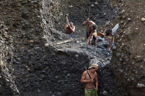 Hand-pickers search for jade through rubble dumped by mining companies at a jade mine in Hpakant township, Kachin State July 7, 2013. REUTER Hand-pickers search for jade through rubble dumped by mining companies at a jade mine in Hpakant township, Kachin State July 7, 2013. REUTER