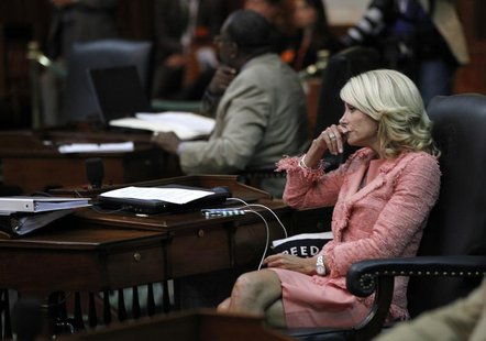 Texas state Democratic Senator Wendy Davis listens as the state Senate meets to consider legislation restricting abortion rights in Austin, Texas state Democratic Senator Wendy Davis listens as the state Senate meets to consider legislation restricting abortion rights in Austin,