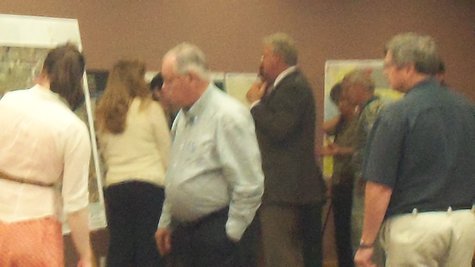 The crowd was asked to look at aerial maps of the city and photos taken from space, and to use post it notes to leave comments and suggestions. The crowd was asked to look at aerial maps of the city and photos taken from space, and to use post it notes to leave comments and suggestions.