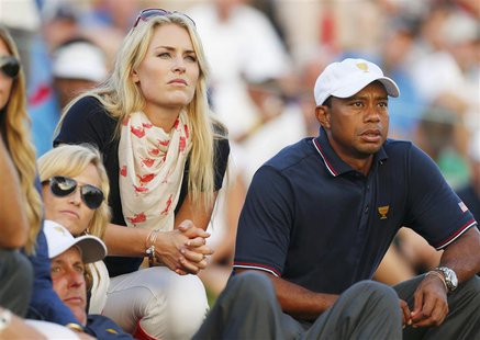 U.S. golfer Tiger Woods and girlfriend Lindsey Vonn sit with teammate Phil Mickelson and Phil's wife Amy (L) as they watch play during the o U.S. golfer Tiger Woods and girlfriend Lindsey Vonn sit with teammate Phil Mickelson and Phil's wife Amy (L) as they watch play during the o