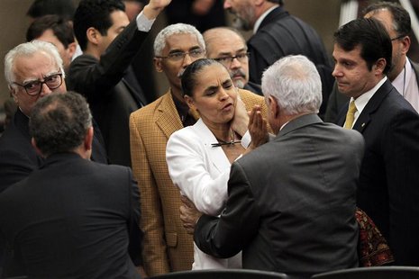 Former Senator Marina Silva is consoled by other lawmakers after the Supreme Electoral Tribunal made the decision not to grant her request t Former Senator Marina Silva is consoled by other lawmakers after the Supreme Electoral Tribunal made the decision not to grant her request t