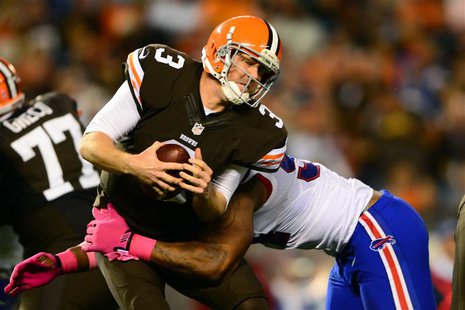 Oct 3, 2013; Cleveland, OH, USA; Cleveland Browns quarterback Brandon Weeden (3) is sacked by Buffalo Bills defensive end Mario Williams (94 Oct 3, 2013; Cleveland, OH, USA; Cleveland Browns quarterback Brandon Weeden (3) is sacked by Buffalo Bills defensive end Mario Williams (94