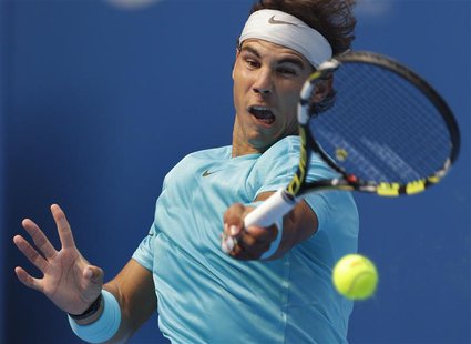 Rafael Nadal of Spain returns a shot during his quarterfinal match against Fabio Fognini of Italy in the China Open tennis tournament at the Rafael Nadal of Spain returns a shot during his quarterfinal match against Fabio Fognini of Italy in the China Open tennis tournament at the