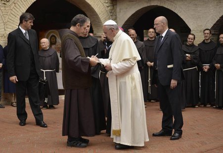 Pope Francis signs a book as he arrives at the San Damian monastery during his pastoral visit in Assisi October 4, 2013. REUTERS/Gian Matteo Pope Francis signs a book as he arrives at the San Damian monastery during his pastoral visit in Assisi October 4, 2013. REUTERS/Gian Matteo