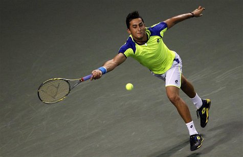 Nicolas Almagro of Spain returns a shot against Kei Nishikori of Japan during their men's singles quarter final match at the Japan Open tenn Nicolas Almagro of Spain returns a shot against Kei Nishikori of Japan during their men's singles quarter final match at the Japan Open tenn