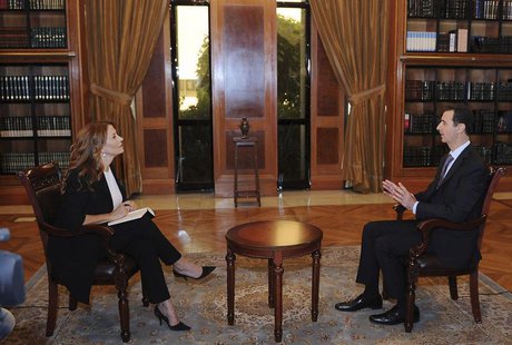 Syria's President Bashar al-Assad (R) speaks during an interview with Italian television station RaiNews24 in Damascus in this handout photo Syria's President Bashar al-Assad (R) speaks during an interview with Italian television station RaiNews24 in Damascus in this handout photo