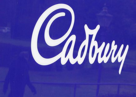 A man is reflected in a sign outside the Cadbury factory in Bournville, central England, in this January 19, 2010 file photo. REUTERS/Darren A man is reflected in a sign outside the Cadbury factory in Bournville, central England, in this January 19, 2010 file photo. REUTERS/Darren