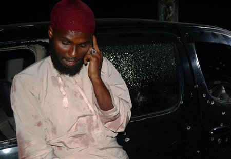 Salim Aboud talks on his phone after he survived the shooting at their vehicle in which Sheikh Ibrahim Ismael and three others were killed n Salim Aboud talks on his phone after he survived the shooting at their vehicle in which Sheikh Ibrahim Ismael and three others were killed n